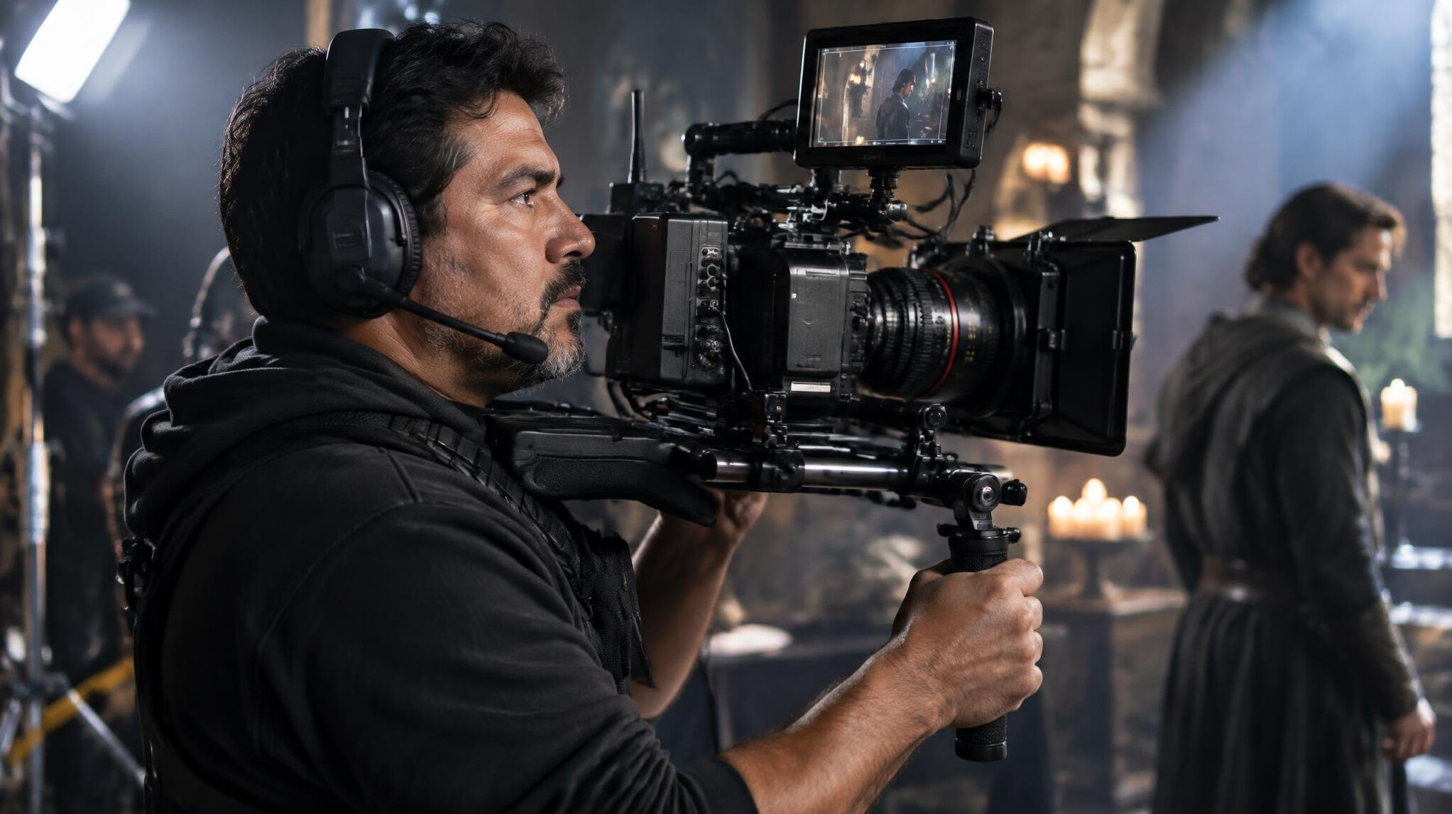 Camera operator filming a scene on a production set